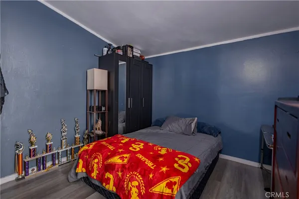 a bedroom with a bed and a closet