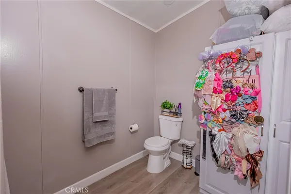 a bathroom with a sink mirror vanity and toilet