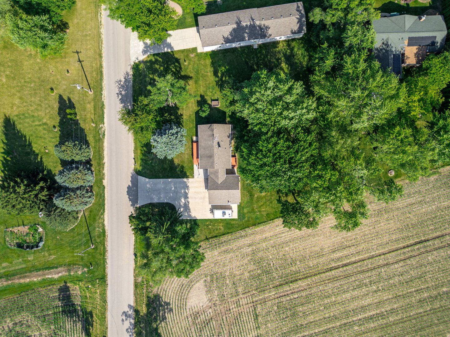 12501 Hebron Road Hebron, IL 60034 - Photo 17 of 19 an aerial view of a house with a yard and garden