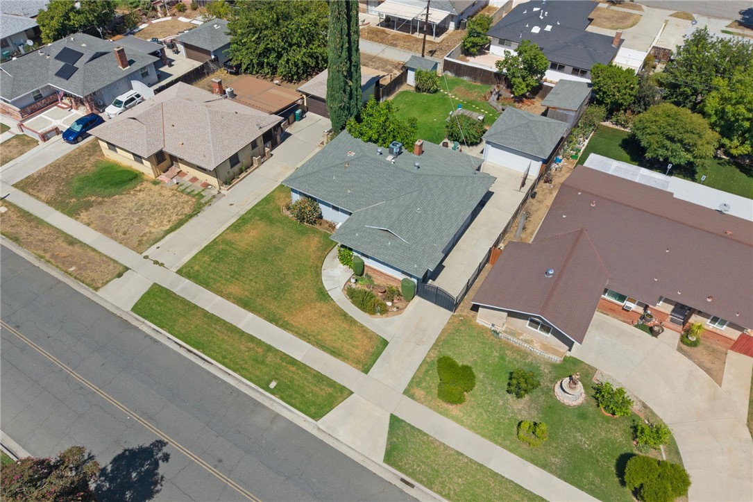5433 Rochester Street Riverside, CA 92504 - Photo 27 of 29 Aerial view of the home, driveway, detached garage, and surrounding neighborhood.