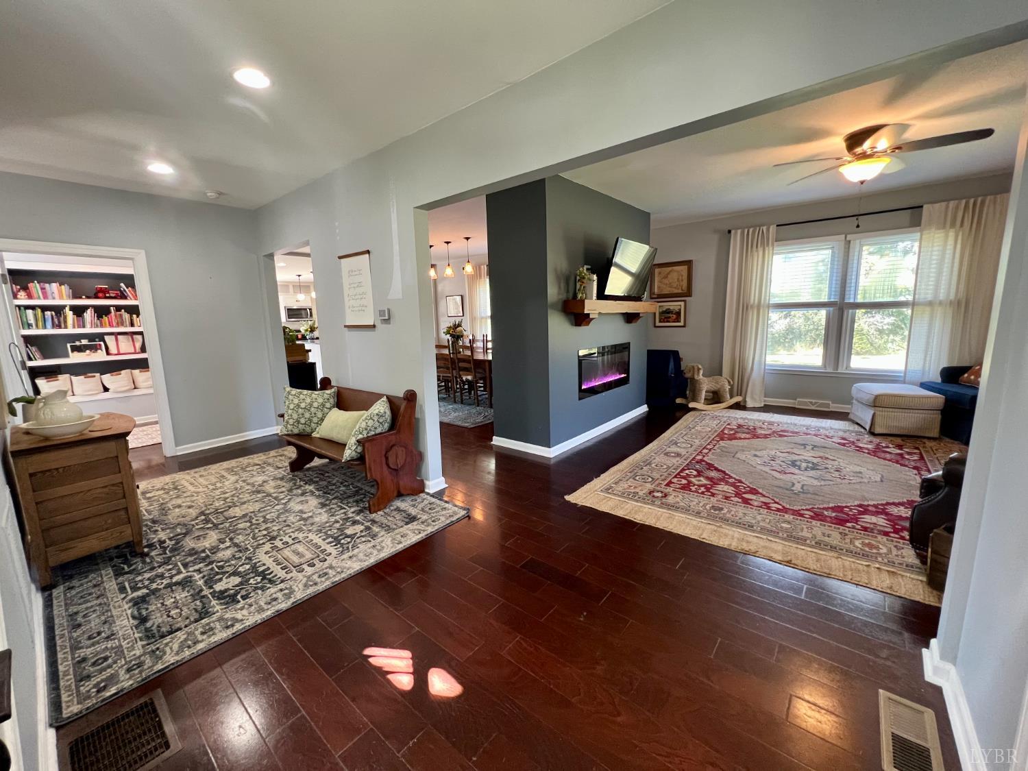 120 North Main Street Amherst, VA 24521 - Photo 11 of 62 a living room with furniture and a flat screen tv