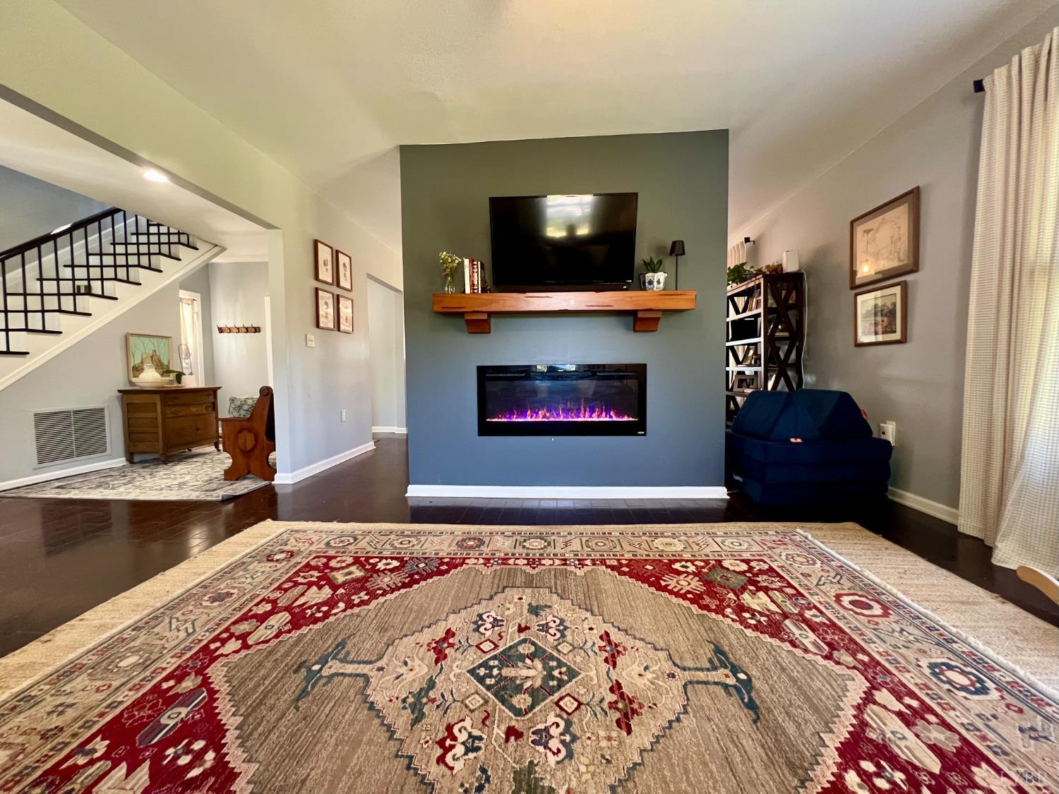 120 North Main Street Amherst, VA 24521 - Photo 15 of 62 a bedroom with a bed and a television