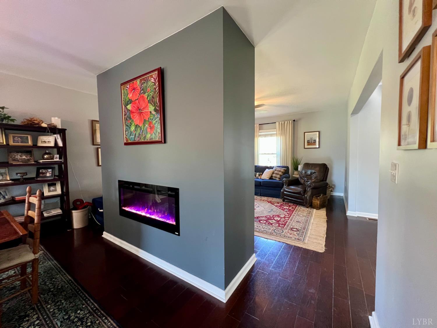 120 North Main Street Amherst, VA 24521 - Photo 17 of 62 a living room with furniture a rug and a fireplace