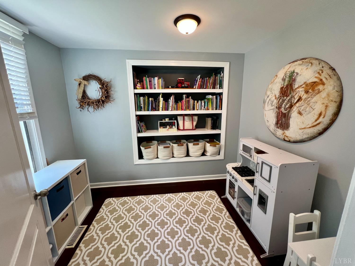 120 North Main Street Amherst, VA 24521 - Photo 27 of 62 a bedroom with furniture and a book shelf