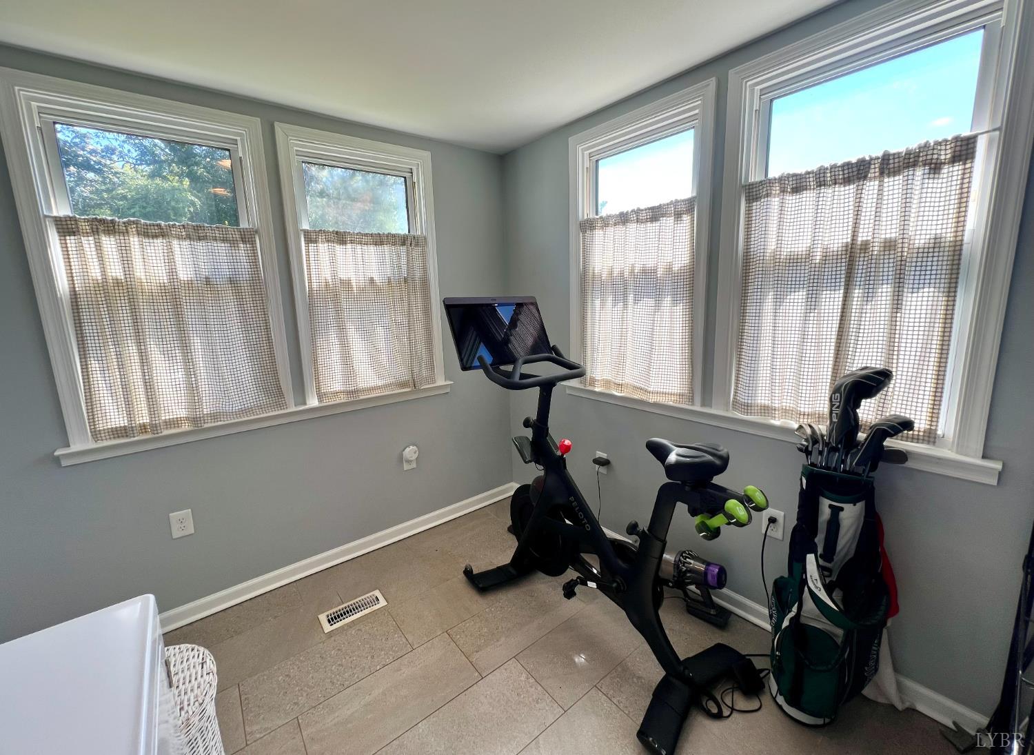 120 North Main Street Amherst, VA 24521 - Photo 30 of 62 a room with gym equipment and a large window