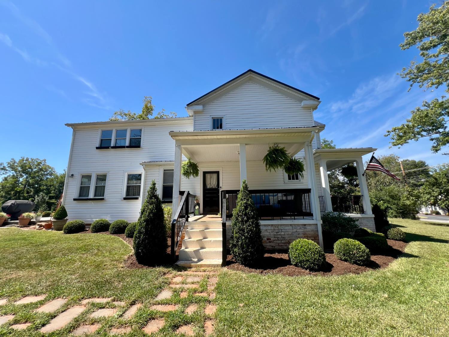120 North Main Street Amherst, VA 24521 - Photo 4 of 62 a view of a house with many windows and a fire pit