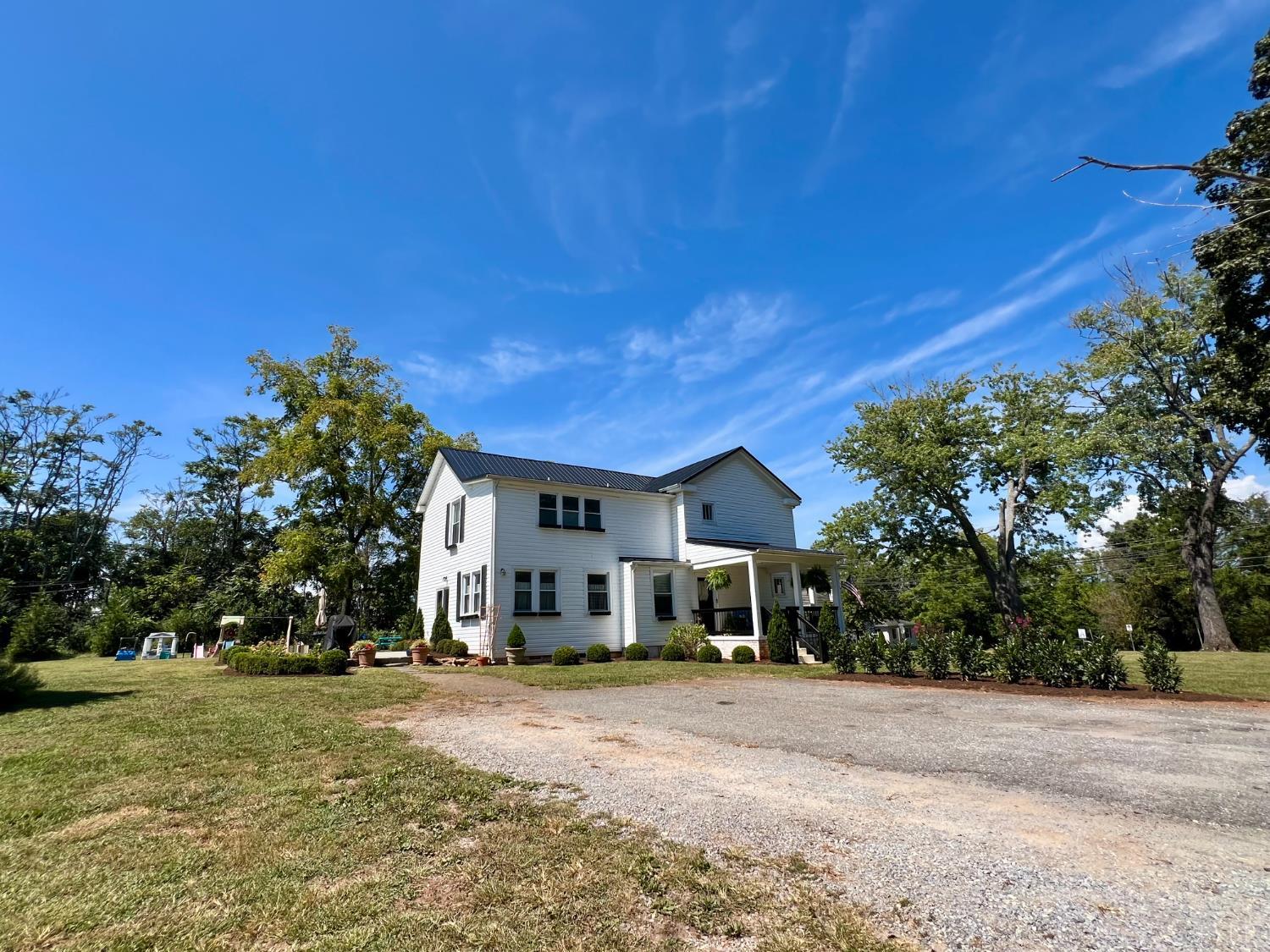 120 North Main Street Amherst, VA 24521 - Photo 49 of 62 a front view of a house with a yard and garage