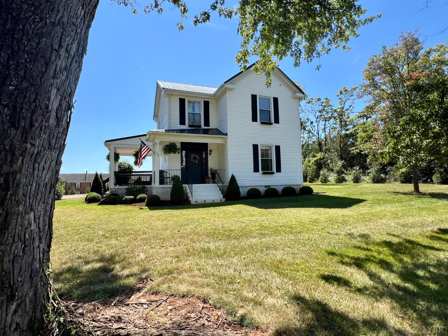 120 North Main Street Amherst, VA 24521 - Photo 60 of 62 a front view of a house with yard and trees