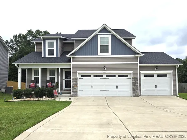 a front view of a house with garden