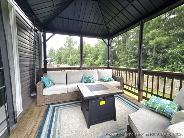 a outdoor living room with furniture and garden view