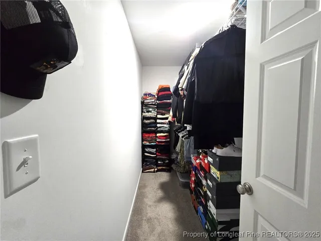 a view of a closet with storage