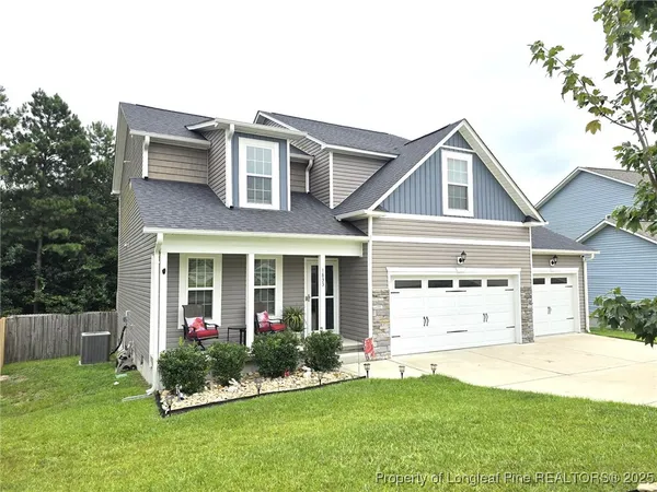 front view of a house with a yard