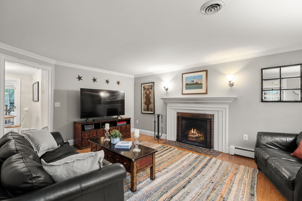 14 Harding Street Medfield, MA 02052 - Photo 13 of 33 a living room with furniture a flat screen tv and a fireplace