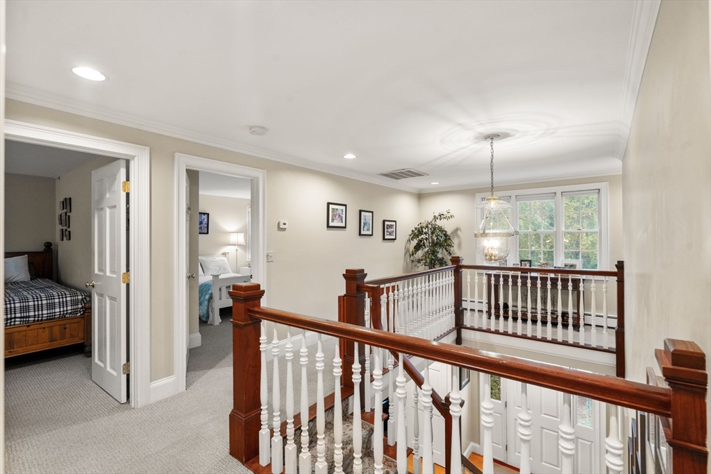 14 Harding Street Medfield, MA 02052 - Photo 16 of 33 a view of hallway with livingroom and stairs