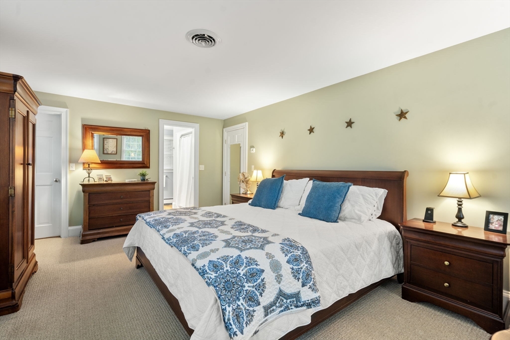 14 Harding Street Medfield, MA 02052 - Photo 17 of 33 a bedroom with a bed and a lamp on dresser