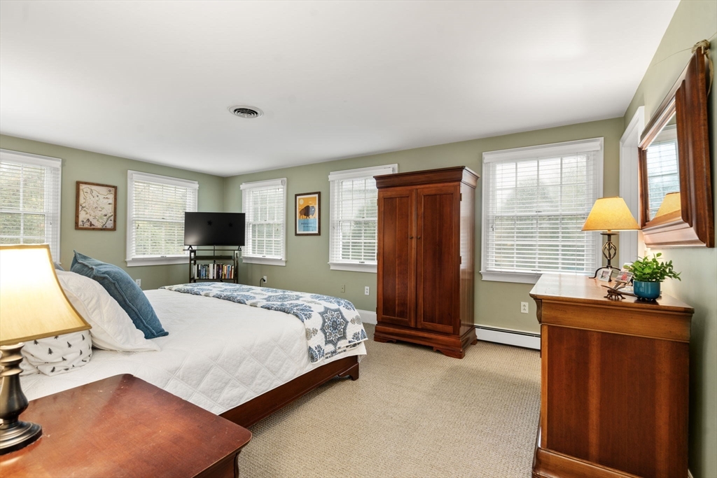 14 Harding Street Medfield, MA 02052 - Photo 18 of 33 a bedroom with a bed and a flat screen tv