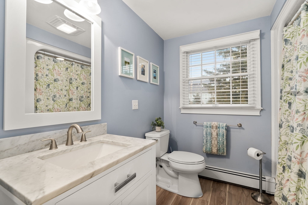 14 Harding Street Medfield, MA 02052 - Photo 19 of 33 a bathroom with a granite countertop toilet sink and mirror