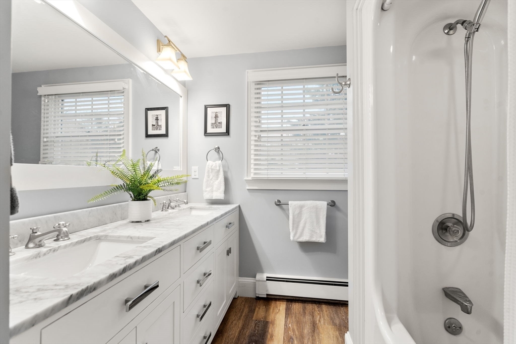 14 Harding Street Medfield, MA 02052 - Photo 21 of 33 a bathroom with a granite countertop sink a toilet and shower