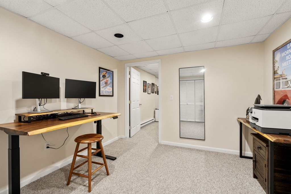 14 Harding Street Medfield, MA 02052 - Photo 25 of 33 a view of a workspace with furniture and a flat screen tv