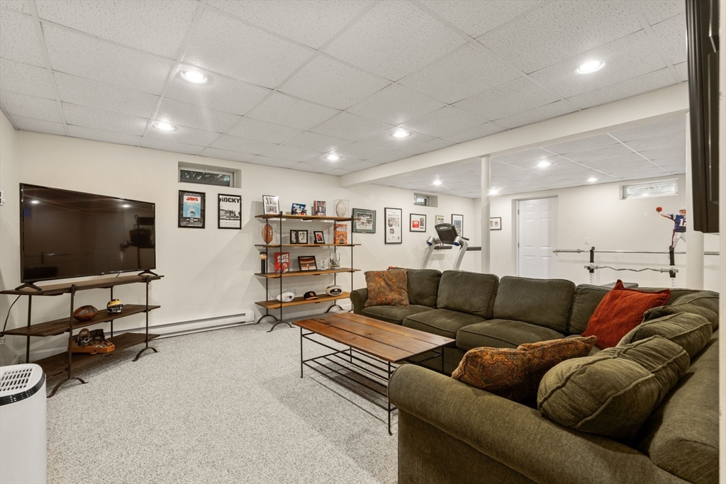 14 Harding Street Medfield, MA 02052 - Photo 26 of 33 a living room with furniture and a flat screen tv