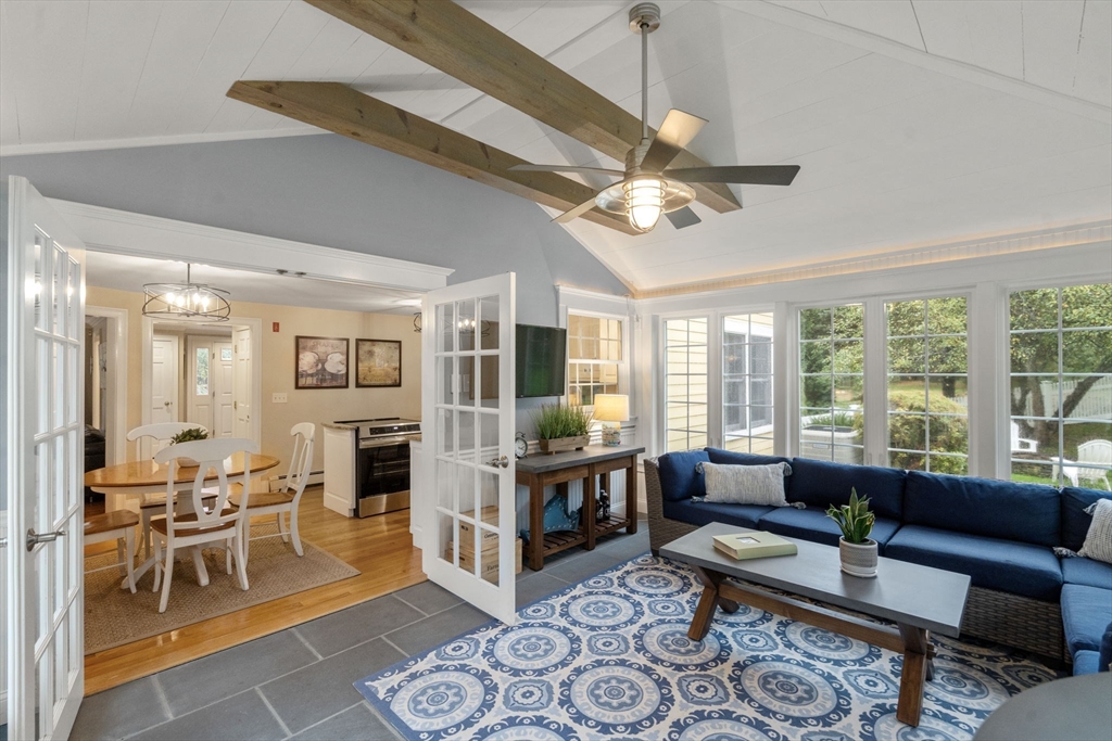 14 Harding Street Medfield, MA 02052 - Photo 10 of 33 a living room with furniture a fireplace and a chandelier