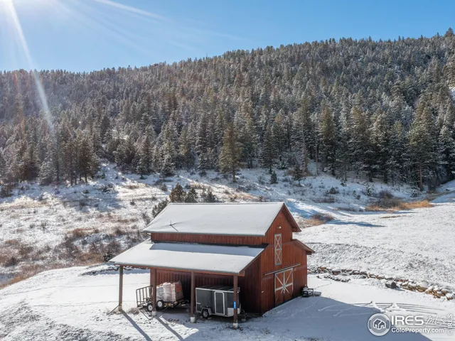 a aerial view of a house with a yard