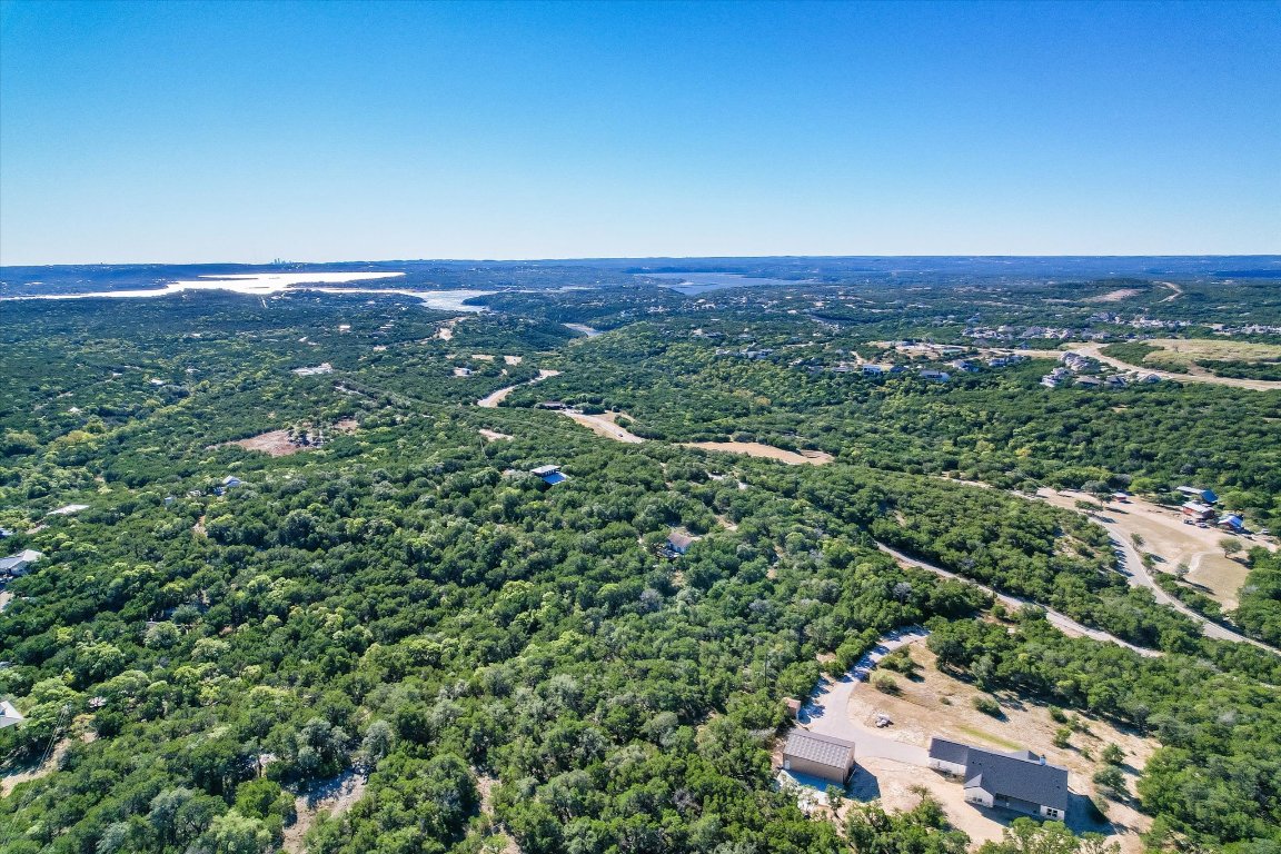 19918 Old Burnet Road Jonestown, TX 78645 - Photo 3 of 11 Drone / aerial view of a heavily wooded area