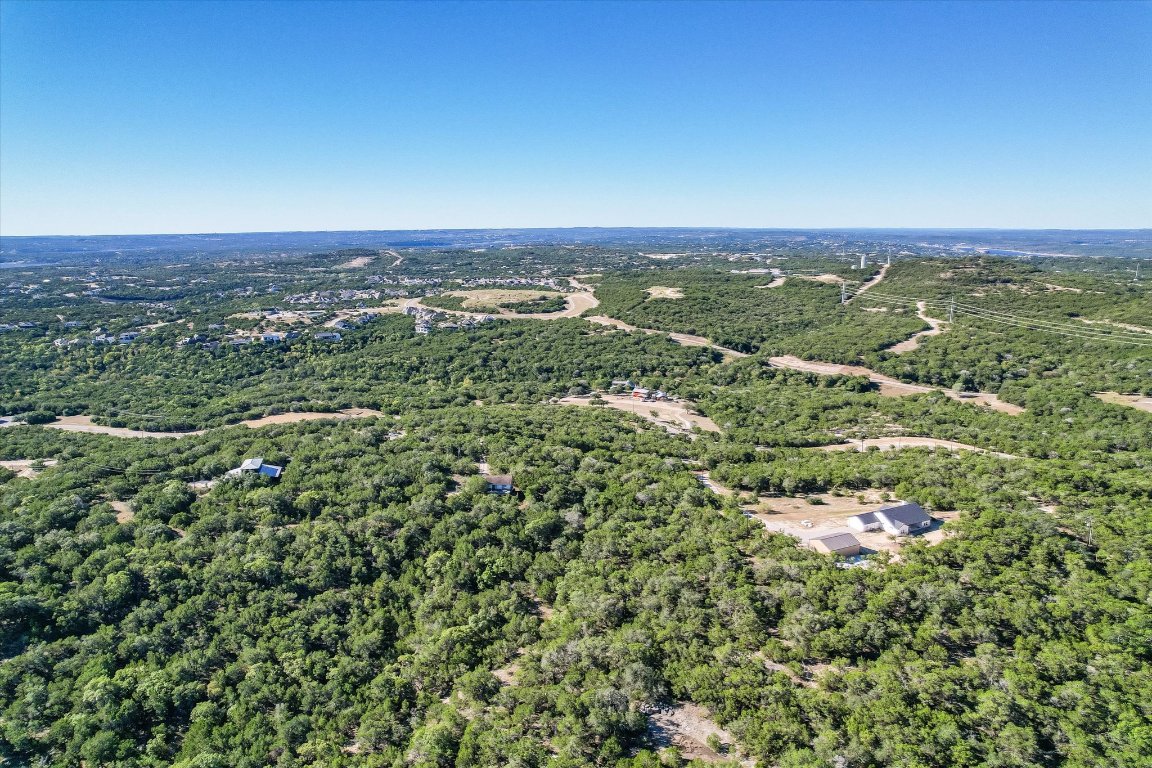 19918 Old Burnet Road Jonestown, TX 78645 - Photo 6 of 11 Drone / aerial view of a heavily wooded area
