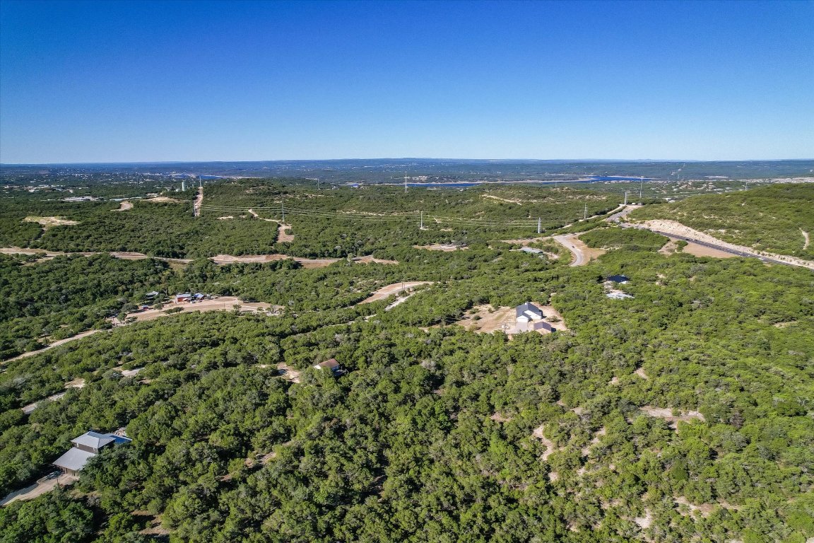 19918 Old Burnet Road Jonestown, TX 78645 - Photo 7 of 11 Aerial view of property and surrounding area featuring a forest