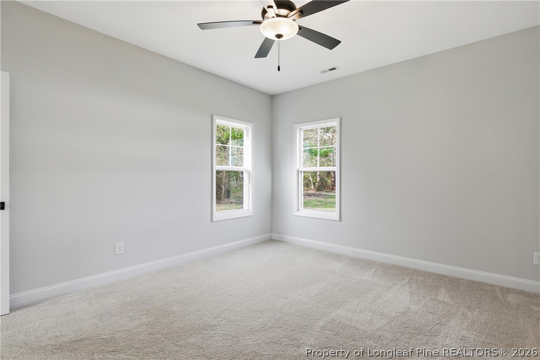 1523 McBryde Lake Road Raeford, NC 28376 - Photo 12 of 32 a view of room with window and ceiling fan