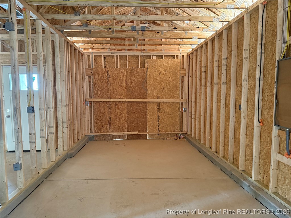 1523 McBryde Lake Road Raeford, NC 28376 - Photo 13 of 14 a view of an empty room with wooden walls