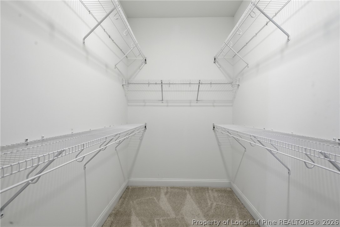 1523 McBryde Lake Road Raeford, NC 28376 - Photo 17 of 32 a view of storage and utility room with racks on the wall