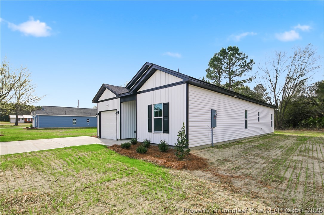 1523 McBryde Lake Road Raeford, NC 28376 - Photo 2 of 32 a view of a backyard with a garden and plants