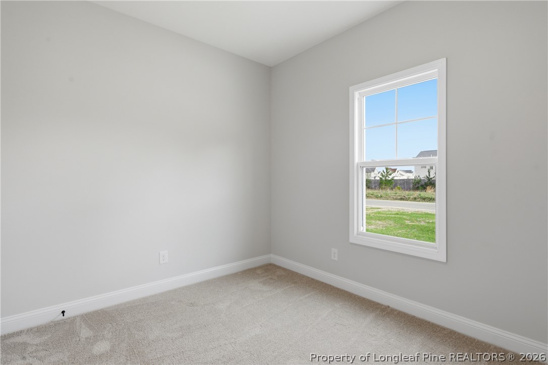 1523 McBryde Lake Road Raeford, NC 28376 - Photo 25 of 32 an empty room with a window