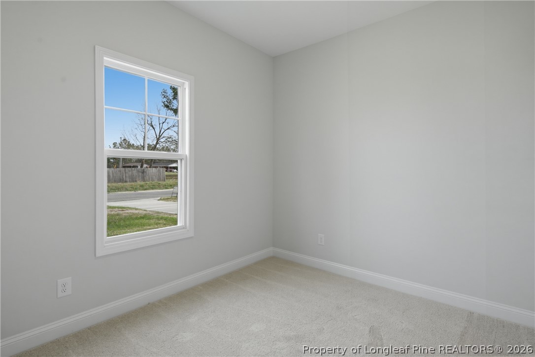 1523 McBryde Lake Road Raeford, NC 28376 - Photo 26 of 32 an empty room with windows