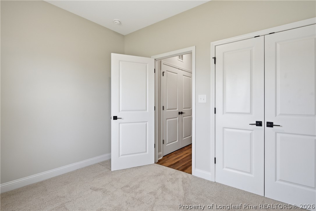 1523 McBryde Lake Road Raeford, NC 28376 - Photo 27 of 32 a view of a bathroom with a shower and a sink