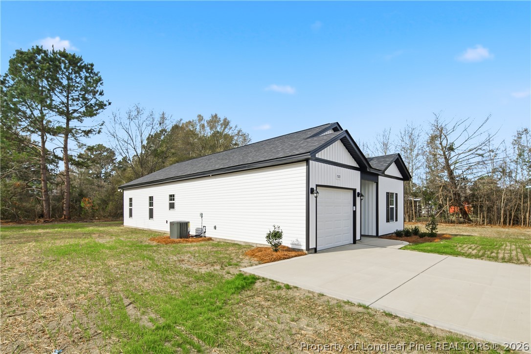 1523 McBryde Lake Road Raeford, NC 28376 - Photo 29 of 32 a big house with a big yard and large trees