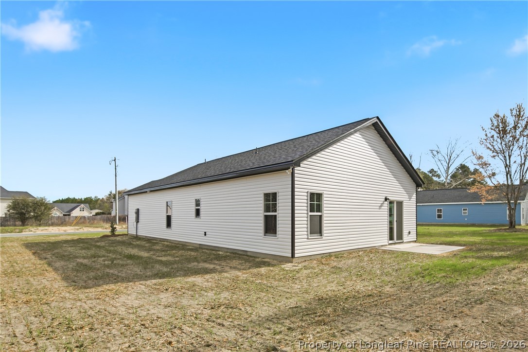 1523 McBryde Lake Road Raeford, NC 28376 - Photo 32 of 32 a view of a house with backyard and road