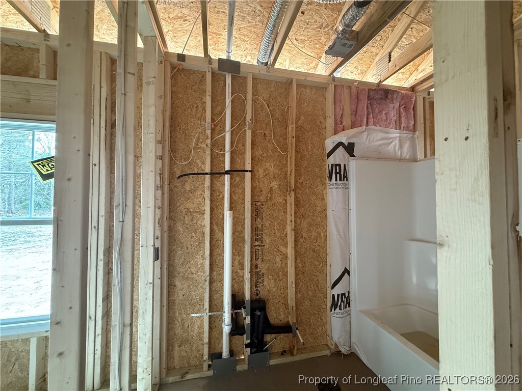 1523 McBryde Lake Road Raeford, NC 28376 - Photo 10 of 14 a bathroom with a shower and a tub