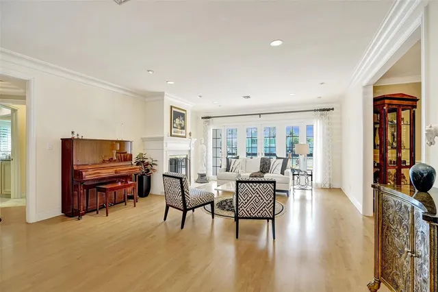 a living room with furniture a ceiling fan and a window