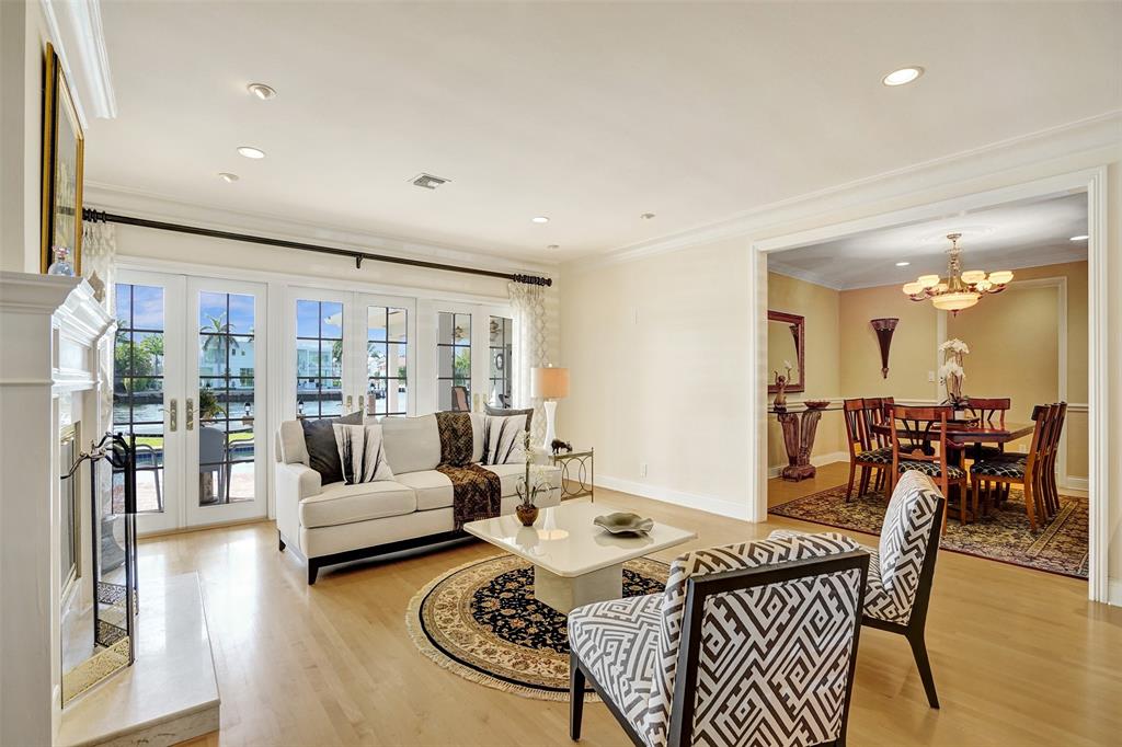 7 Saranac Road Sea Ranch Lakes, FL 33308 - Photo 14 of 93 a living room with furniture and a large window
