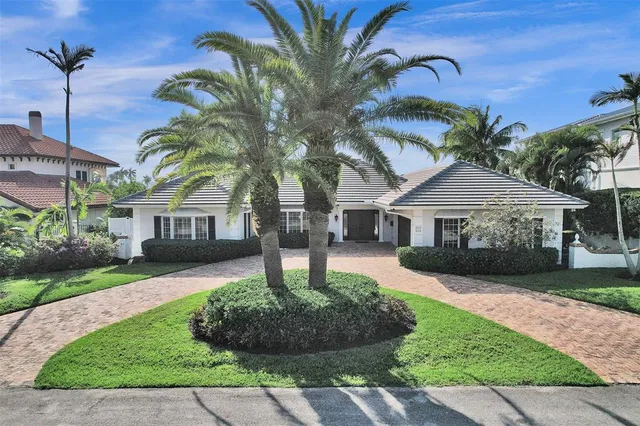 a front view of a house with a garden and entryway