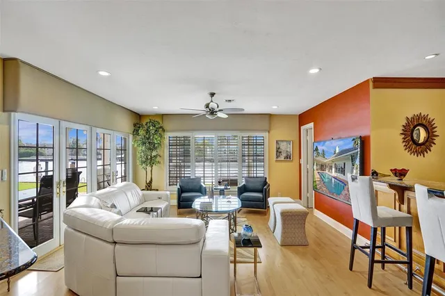 a spacious bedroom with a balcony a bed and a fireplace