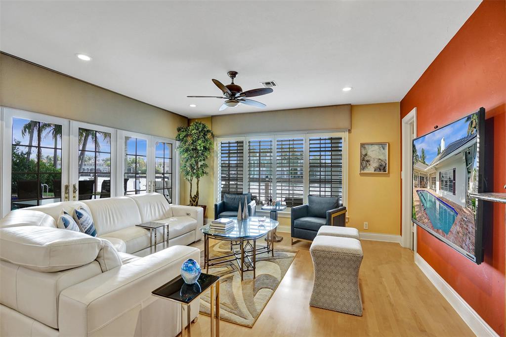 7 Saranac Road Sea Ranch Lakes, FL 33308 - Photo 28 of 93 a living room with furniture ceiling fan and a large window