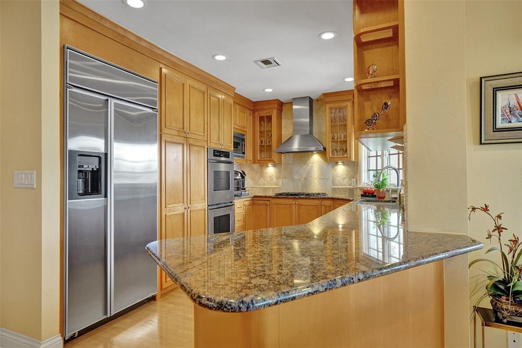 7 Saranac Road Sea Ranch Lakes, FL 33308 - Photo 36 of 93 a view of a kitchen with stainless steel appliances granite countertop a refrigerator and a sink