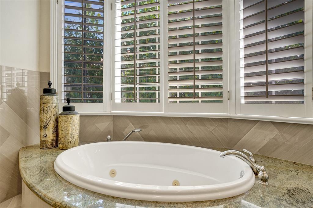 7 Saranac Road Sea Ranch Lakes, FL 33308 - Photo 50 of 93 a bath tub sitting in a bathroom next to a window