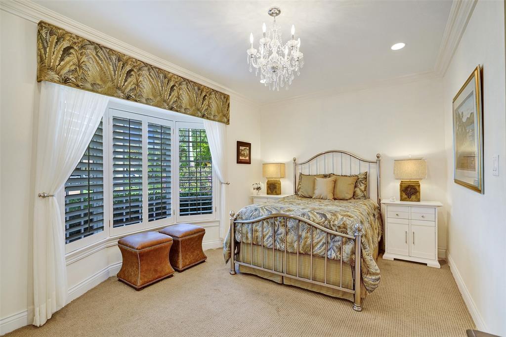 7 Saranac Road Sea Ranch Lakes, FL 33308 - Photo 51 of 93 a bedroom with a bed chair and window