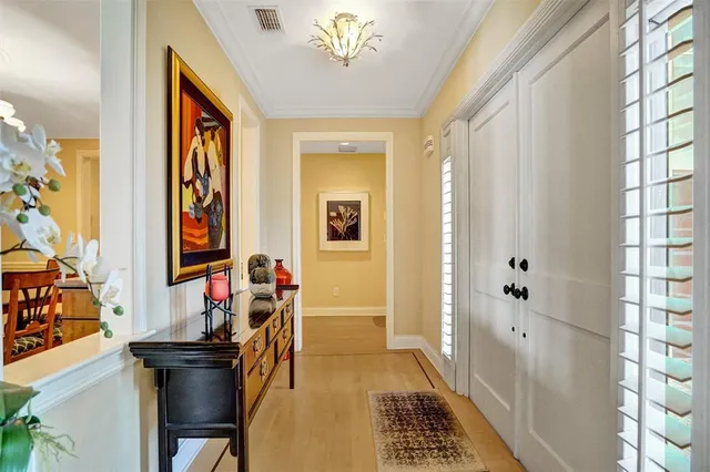 a view of a dining room with furniture and a chandelier