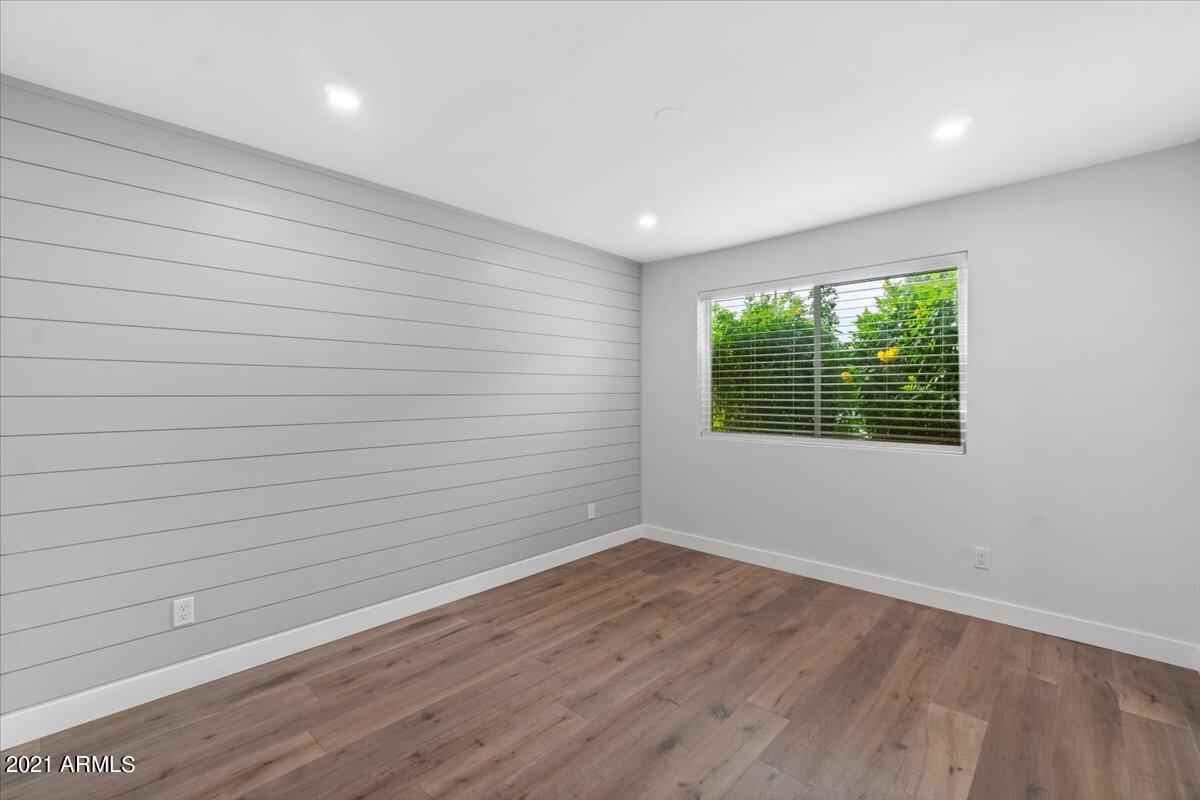 4041 East Camelback Road, Unit 2 Phoenix, AZ 85018 - Photo 12 of 25 wooden floor in an empty room with a window
