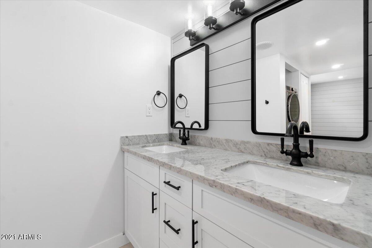 4041 East Camelback Road, Unit 2 Phoenix, AZ 85018 - Photo 15 of 25 a bathroom with a sink and a mirror